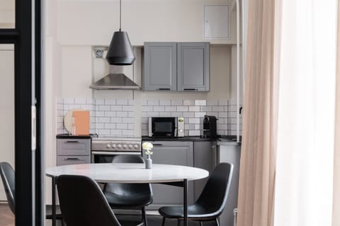 Design Apartment | Private kitchen | Full-size fridge, microwave, oven, stovetop