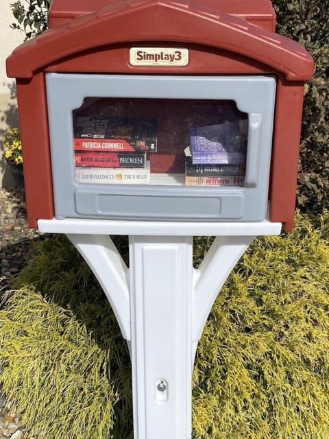 Leave a Book/Read a Book. Located in front of Indoor Pool