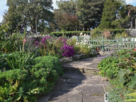 Charming stone garden path | Haulfryn Cottage, Llandegfan, near Menai Bridge