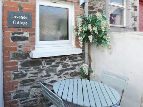 Modest outdoor area with table and chairs | Lavender Cottage, Buckfastleigh