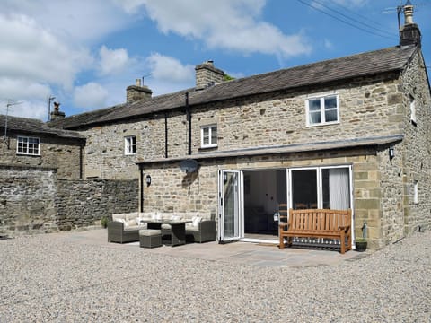 Smart bi-fold doors and outdoor furniture on patio | Pear Tree Cottage and The Granary, East Witton, near Leyburn