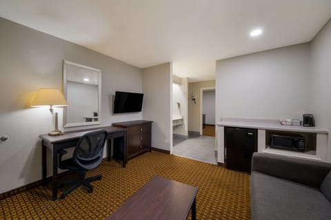 Suite, Non Smoking (1 King Bed with 2 Person Sofa bed) | Desk, laptop workspace, blackout drapes, iron/ironing board