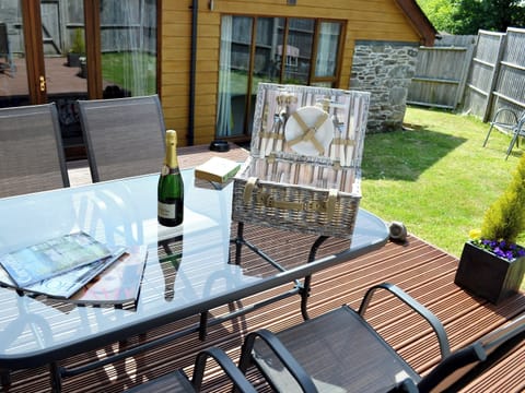 Inviting decking with relaxing sitting-out-area | Blackthorn Cottage, Swan Pool, near Falmouth
