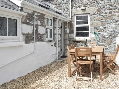 Peaceful patio area | Morvoren (Sea Maiden) Cottage, The Lizard Village, near Helston