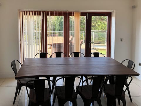 Large dining area with bi-fold doors | Hafan Dawel, Stepaside, near Saundersfoot