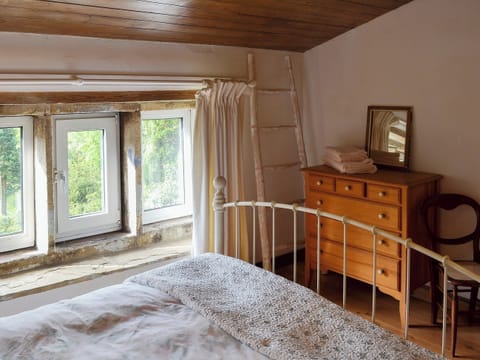 Bedroom with wooden ceiling and antique style double bed | Pear Tree House Annexe, Wooldale, near Holmfirth