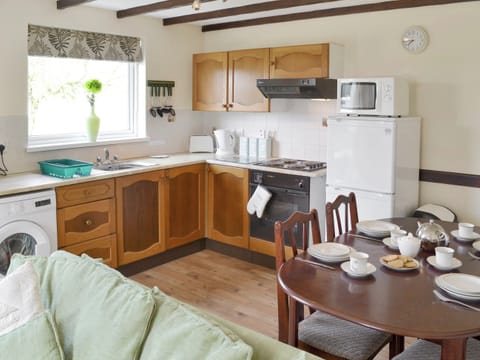 Well-equipped kitchen with convenient dining area | Walnut - Thornbury Holiday Park, Woodacott, near Holsworthy