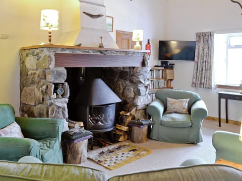 Log-burning fire in traditional fireplace | Tigh na’ Caoiraich, Invergarry, Tomdoun