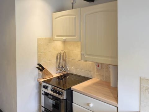 Compact fitted kitchen | Riverside Cottage, Betws-y-Coed