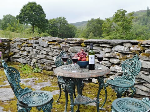 Outdoor furniture in courtyard | Riverside Cottage, Betws-y-Coed