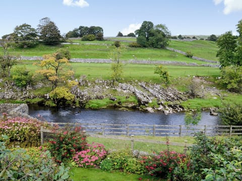 Expansive views from the rear over the River Wharfe. | Inglenook Cottage, Linton Falls, near Grassington