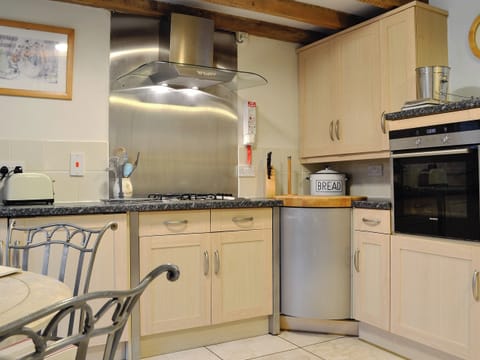 Well equipped kitchen area | The Granary - Crwys Farm, Three Crosses, Gower, Swansea