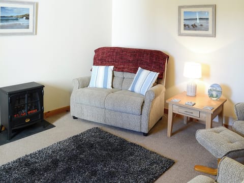 Lovely comfortable living room with electric wood burner | Eagle Cottage, near Culkein