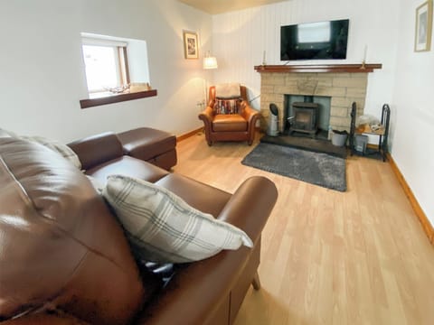 Cosy multifuel stove for chilly evenings. 49’ smart tv with Sky and Prime included. | Riverside Cottage, Drumnadrochit, near Loch Ness