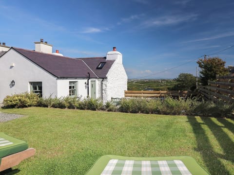 Exterior rear garden | Fferam Gorniog, Holyhead Mountain, near Trearddur Bay