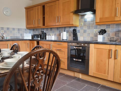 Kitchen and dining area | Yr Hen Feudy - Bronallt Barns, Llanynghenedl, near Holyhead