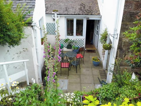 Small patio with garden furniture | Ivybank Cottage, Lamlash, Isle of Arran