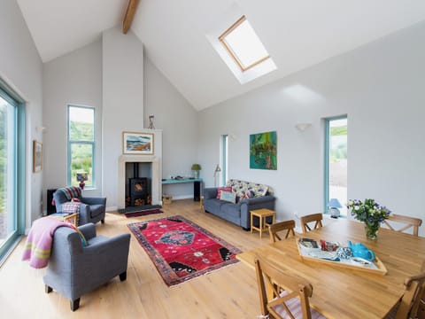 Local painters and artists are widely featured throughout the comfortable and tasteful living and dining rooms. Teak outdoor furniture is available. | Tigh An Iasgair, Fearnbeg, near Applecross