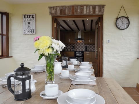 Convenient dining room adjoining kitchen | Llofft Storws - Bronallt Barns, Llanynghenedl, near Holyhead