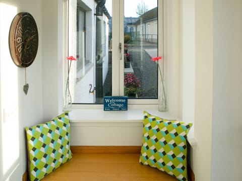 Cosy window seat by the front door | Rossie Cottage, Auchterarder, near Gleneagles Village