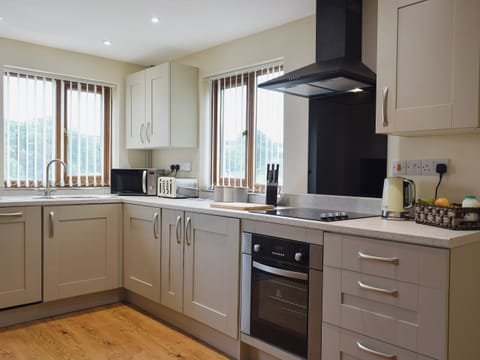Galley style kitchen area | Gardeners Lodge, near Pembroke