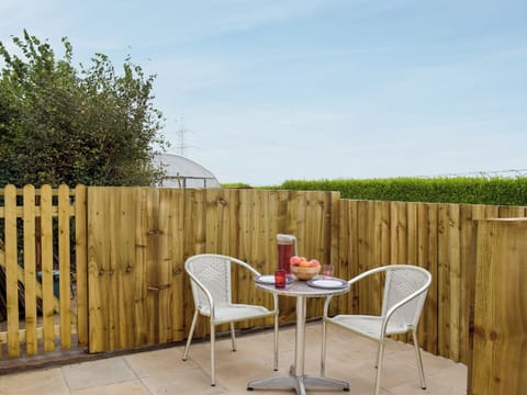 Small enclosed courtyard with patio, garden furniture and BBQ | Gardeners Lodge, near Pembroke