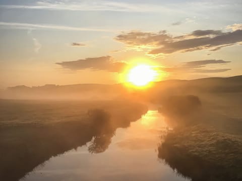 View of the garden and douglas water in the morning | Harperfield Chalet, Lanark