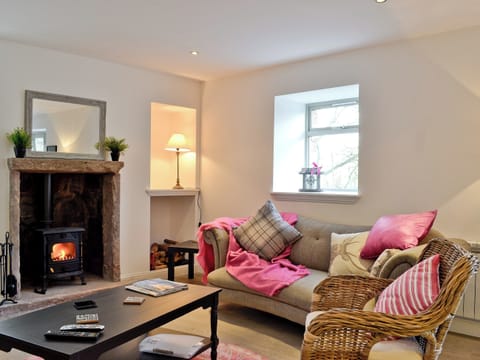 Living room with inglenook fireplace and wood burning stove | St Ronan’s Place, Gartocharn, near Drymen