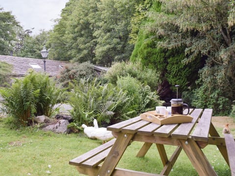 Lawned garden area with outdoor furniture | The Mill, Mungrisdale near Keswick