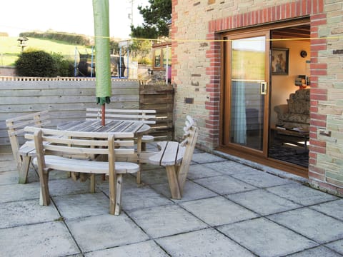 Lovely private paved patio area | Merlin View - Higher Lanvean Farm, St Mawgan, near Newquay