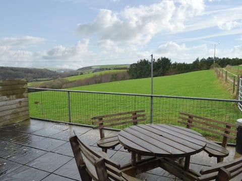 Paved patio area with seating | Merlin View - Higher Lanvean Farm, St Mawgan, near Newquay