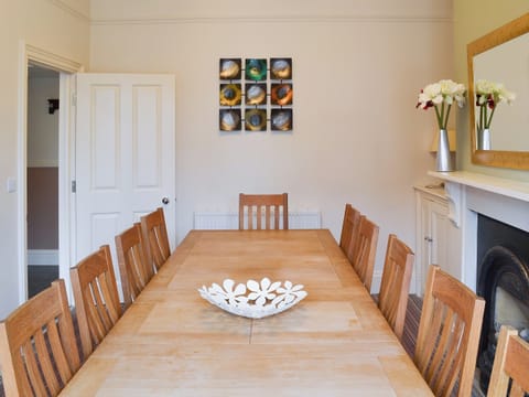 Dining room with large table seating up to 10 people | Bay House, Filey
