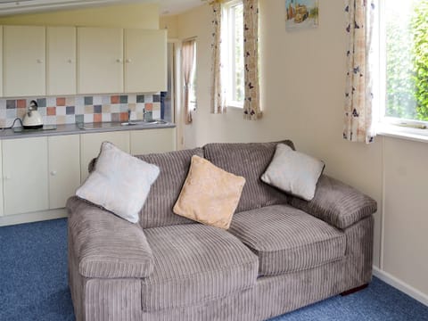 Comfy sofa in lounge | Heather Brae Lodge, Nancledra, near Penzance