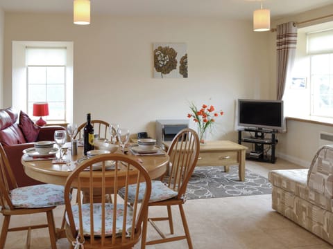 Convenient dining area within an open plan living space | Pennan Lodge - Nethermill Cottages, Pennan, near New Aberdour