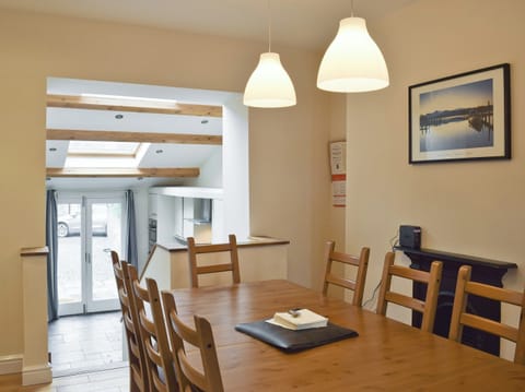 Open plan design connecting dining area to kitchen | Falcon Crag, Keswick