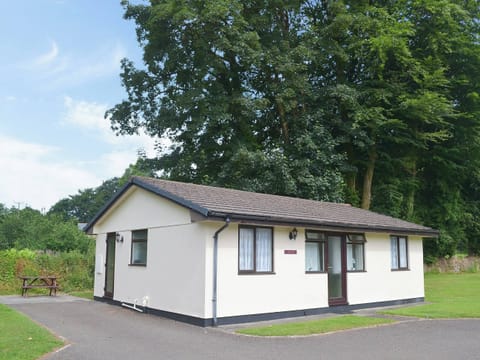 Modest holiday cottage with picnic-style seating for alfresco dining | Trebah - Rosecraddoc Holiday Village, Liskeard