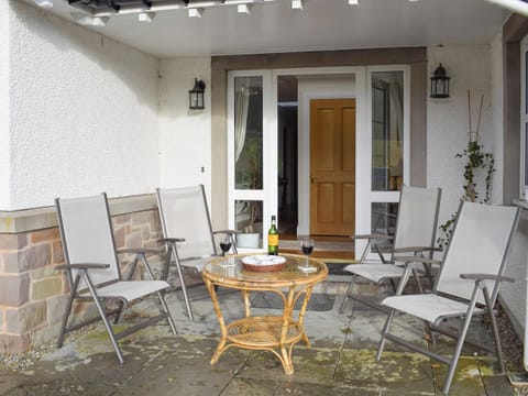 Covered seating area at main entrance | Heather Croft - Hatton Cottages, Dunkeld, near Pitlochry