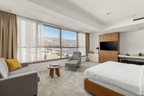 Luxury Suite, Sea View | Minibar, in-room safe, desk, laptop workspace