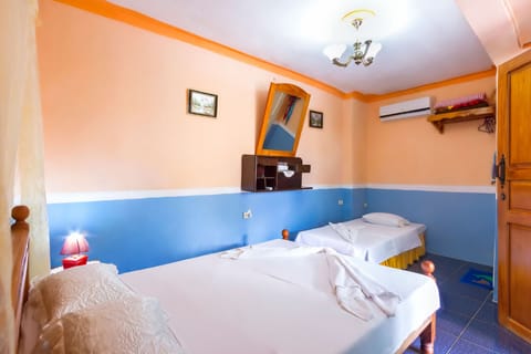 Romantic Triple Room, Mountain View | Minibar, blackout drapes, free WiFi, bed sheets