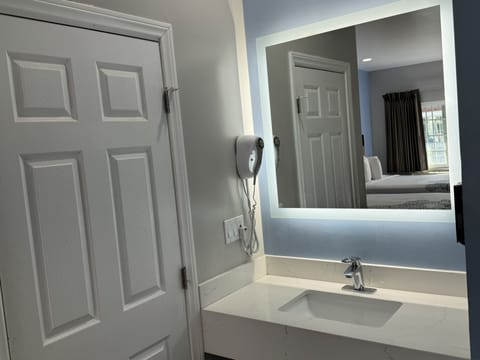 Standard Double Room, 2 Queen Beds | Bathroom | Combined shower/tub, hair dryer, towels
