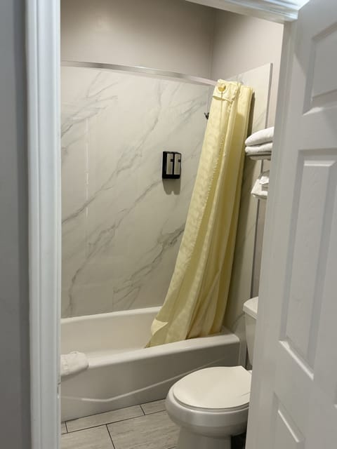 Standard Double Room, 2 Queen Beds | Bathroom | Combined shower/tub, hair dryer, towels