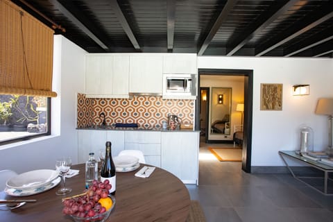 Suite 5 apartment | Private kitchen | Full-size fridge, electric kettle, cookware/dishes/utensils