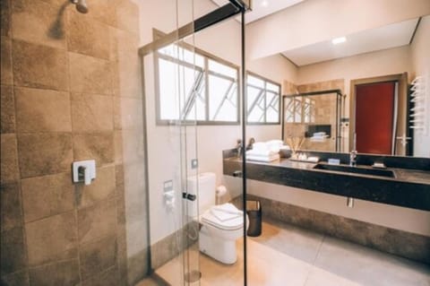 Premium Suite, 1 King Bed, Non Smoking | Bathroom amenities | Designer toiletries, hair dryer, towels