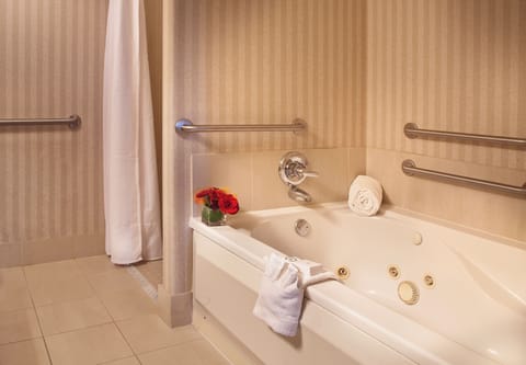 Suite, 1 King Bed, Accessible, Fireplace | Bathroom | Designer toiletries, hair dryer, towels, soap