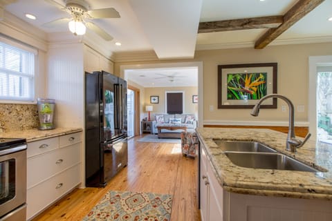 Open kitchen and dining room area with dining seating for 4