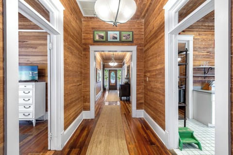 Continue down hallway to primary bedroom and kitchen