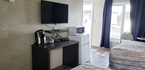 Comfort Room, 2 Double Beds | Living area | Flat-screen TV