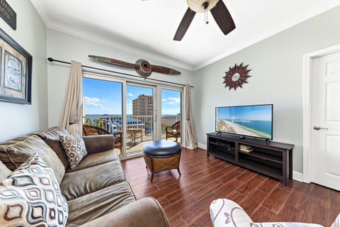 Signature Condo, 2 Bedrooms, Balcony, Beach View | Living room | 50-inch Smart TV with cable channels