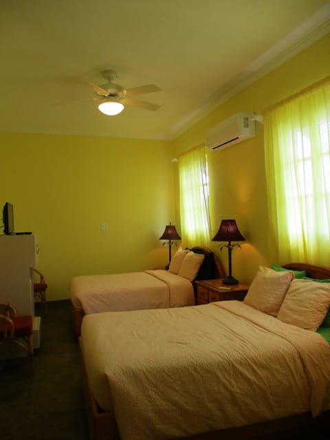 Family Room, Multiple Beds, Private Bathroom, Partial Sea View | In-room safe, desk, iron/ironing board, free WiFi