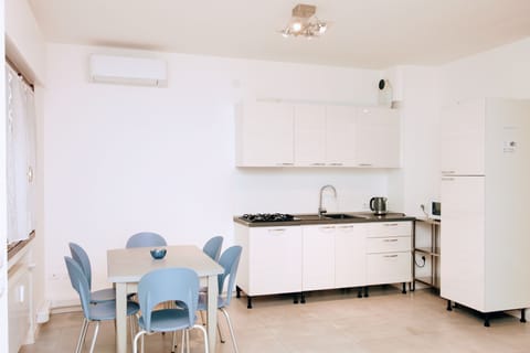 Fridge, stovetop, espresso maker, coffee/tea maker